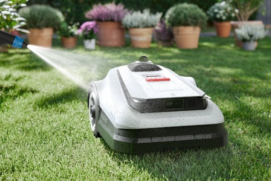 goat robot lawn mower getting a rinse