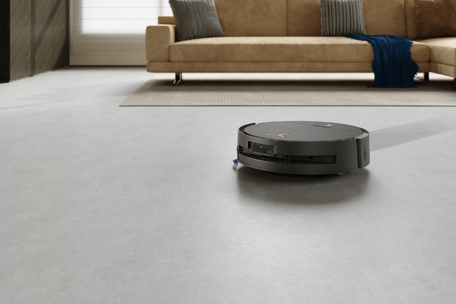 deebot robot vacuum and mop cleaner cleaning near sofa