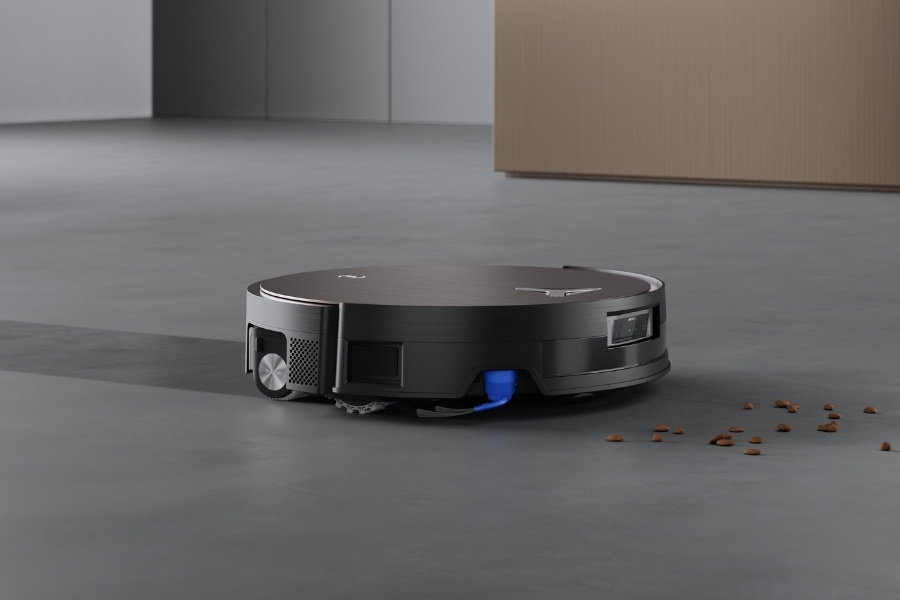 deebot robot vacuum mopping and vacuuming cat litter on the floor