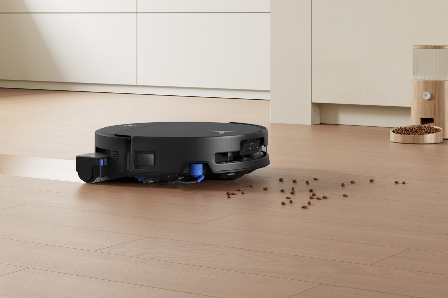 deebot robot vacuum lifting litter on the floor