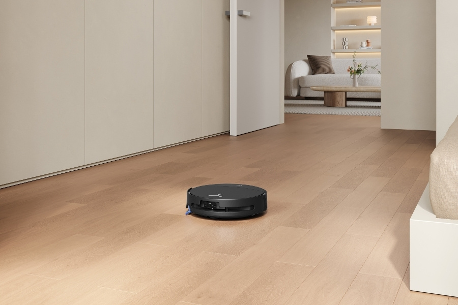 deebot robot vacuum cleaning in the middle of a path