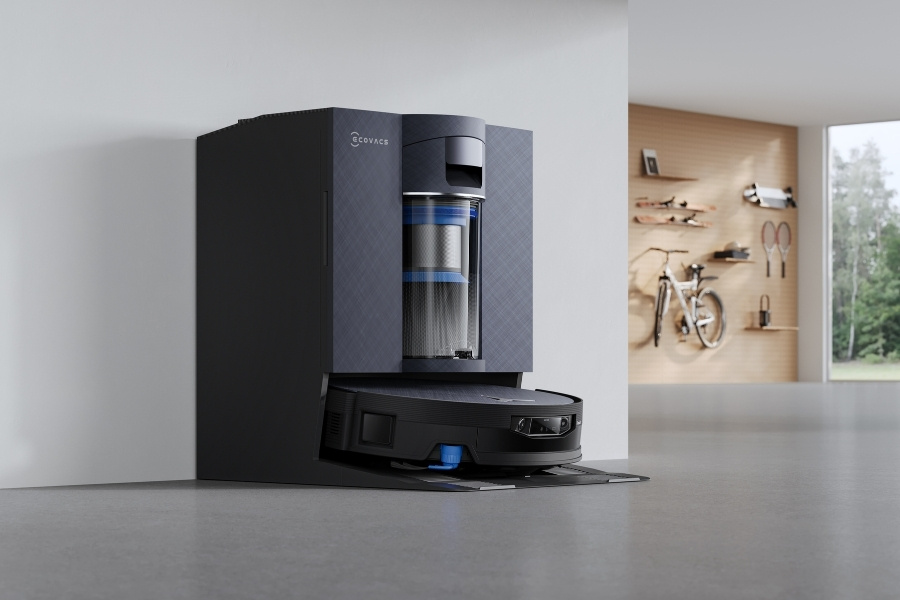 deebot robot vacuum charging in a multi-purpose storage room