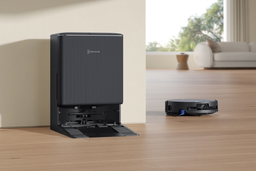 deebot robot vacuum cleaning near the docking station
